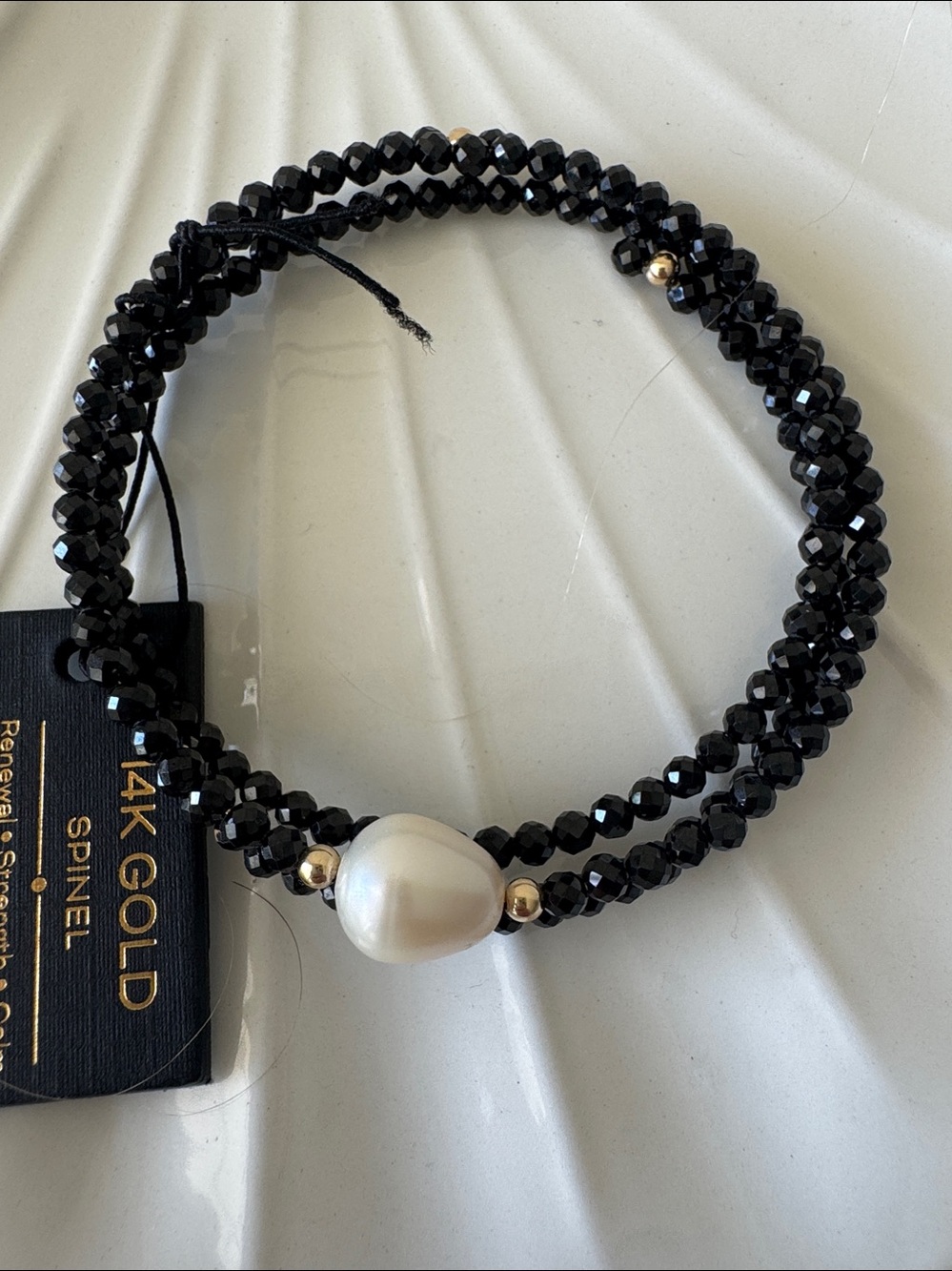 GEORG K
made in usa 14kt gold black spinel pearl
wrap bracelet
